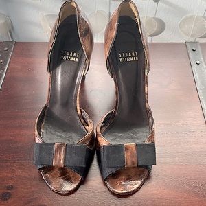 Stuart Weitzman open-toed animal print pumps.